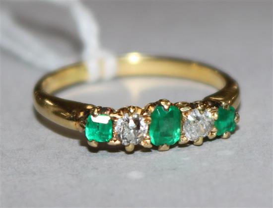 An emerald and diamond five-stone ring, 18ct gold shank, size L.